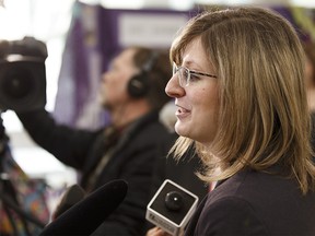 Minster Stephanie McLean, Minister of Service Alberta and Minister of Status of Women, speaks to the media at City Hall during International Women's Day celebrations in Edmonton on Wednesday, March 8, 2017. Ian Kucerak / Postmedia