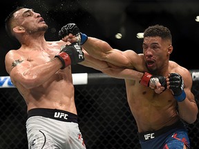 Kevin Lee punches Tony Ferguson in their interim UFC lightweight championship bout during UFC 216 at T-Mobile Arena on October 7, 2017 in Las Vegas. (Brandon Magnus/Zuffa LLC/Zuffa LLC via Getty Images)