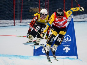 Sweden's Sandra Naeslund (right) and Canada's Kelsey Serwa ski during the women's semifinal at the World Cup ski cross event at Nakiska Ski resort in Kananaskis, Alta., Saturday, Jan. 20, 2018.