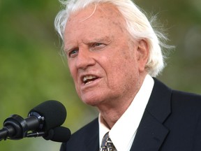 FILE - In this June 26, 2005 file photo, the Rev. Billy Graham speaks on stage on the third and last day of his farewell American revival in the Queens borough of New York. A spokesman said on Graham has died at his home in North Carolina at age 99.