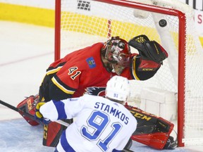 Lightning Steve Stamkos scores on Flames goalie Mike Smith in the third period during game action between the Tampa Bay Lightning and Calgary Flames in Calgary on Thursday, February 1, 2018. Jim Wells/Postmedia