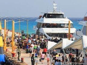 Federal police officers and army soldiers arrive at the dock where an explosion occurred on a ferry in Playa del Carmen, Quintana Roo state, Mexico on February 21, 2018. (STR/AFP/Getty Images)