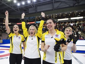 Manitoba, left to right, Shannon Birchard, Jennifer Jones, Jill Officer and Dawn McEwen celebrate their win over the Wild Card team at the Scotties Tournament of Hearts in Penticton, B.C., on Sunday, Feb. 4, 2018.