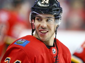 Flames defenceman Travis Hamonic skates during warm up in Calgary on Dec. 16, 2017.