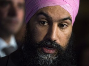 NDP Leader Jagmeet Singh is joined by members of his party as they hold press conference on Parliament Hill in Ottawa on Wednesday Dec. 13, 2017. THE CANADIAN PRESS/Sean Kilpatrick