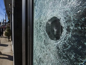Masked vandals dressed in black broke windows and caused other damage in Hamilton, including at Condo Culture (pictured). Ernest Doroszuk, Toronto Sun)