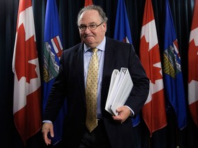 Transportation Minister Brian Mason leaves a press conference after tabling amendments to the Traffic Safety Act in preparation for the legalization of cannabis, at the Alberta Legislature in Edmonton on Nov. 14, 2017.