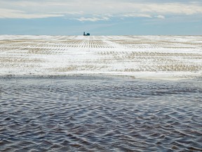 Meltwater in a field south of Enchant, Ab., on Tuesday March 27, 2018. Mike Drew/Postmedia