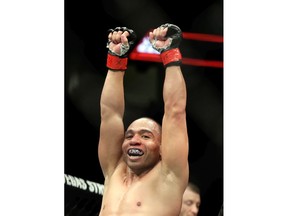 John Dodson celebrates his split decision victory over Pedro Munhoz following their bantamweight bout during UFC 222 at T-Mobile Arena on March 3, 2018 in Las Vegas, Nevada.
