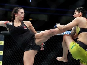 Cat Zingano (L) kicks Ketlen Vieira during their women’s bantamweight bout during UFC 222 at T-Mobile Arena on March 3, 2018 in Las Vegas, Nevada. Vieira won by split decision.