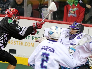 The Calgary Roughnecks' Wesley Berg fires a shot on Rochester Knighthawks goaltender Angus Goodleaf during NLL action at the Scotiabank Saddledome in Calgary on Saturday March 17, 2018.