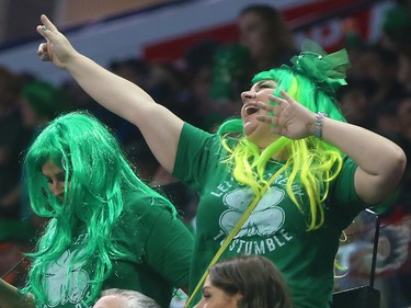 Fans cheer on the Calgary Roughnecks as they play the Rochester Knighthawks on St. Patrick's Day at the Scotiabank Saddledome in Calgary on Saturday March 17, 2018.