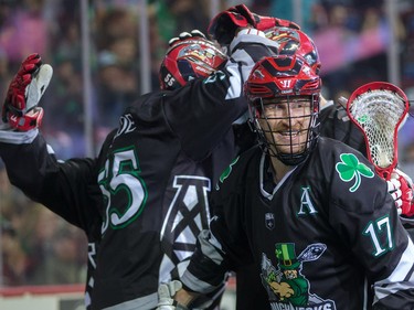 The Calgary Roughnecks Curtis Dickson smiles as he and teammates celebrate scoring on the Rochester Knighthawks during NLL action at the Scotiabank Saddledome in Calgary on Saturday March 17, 2018.