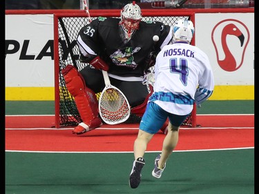Calgary Roughnecks goaltender Christian Del Bianco stops this shot from the Rochester Knighthawks' Graeme Hossack during NLL action at the Scotiabank Saddledome in Calgary on Saturday March 17, 2018.