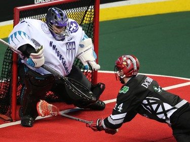 The Calgary Roughnecks' Dane Dobbie fires a shot on Rochester Knighthawks goaltender Angus Goodleaf during NLL action at the Scotiabank Saddledome in Calgary on Saturday March 17, 2018.