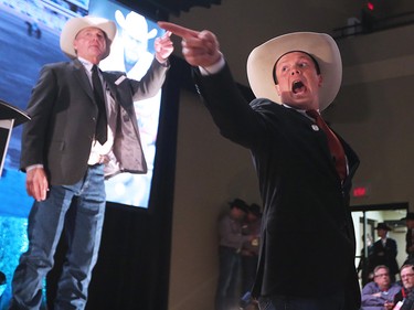 Auction staff help take bids during the GMC Rangeland Derby canvas auction at Stampede Park on Thursday March 22, 2018. 
Gavin Young/Postmedia