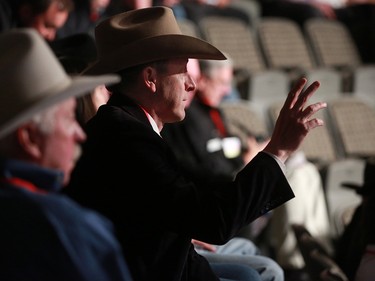 A bidder signals auctioneers during the GMC Rangeland Derby canvas auction at Stampede Park on Thursday March 22, 2018. 
Gavin Young/Postmedia