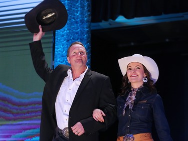 Chuckwagon driver Jason Glass salutes the crowd at the GMC Rangeland Derby canvas auction at Stampede Park on Thursday March 22, 2018. 
Gavin Young/Postmedia