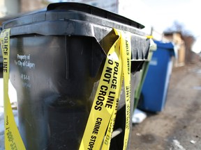 Discarded crime scene tape was all that remained behind homes in the 100 block of Margate Close N.E. Thursday morning after a dog was shot and killed during a home invasion on the street Wednesday evening.