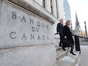 Bank of Canada Governor Stephen Poloz and Carolyn Wilkins, Senior Deputy Governor, walk to the National Press Gallery in Ottawa on Wednesday, October 25, 2017.