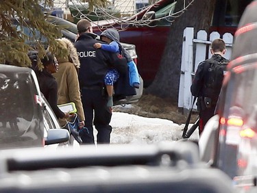 Calgary police at the scene in Abbeydale on Tuesday March 27, 2018 where a police officer was shot. The officer is reportedly in stable condition.