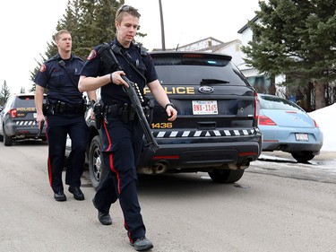Calgary police at the scene in Abbeydale on Tuesday March 27, 2018 where a police officer was shot. The officer is reportedly in stable condition.