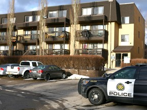 Calgary police hold the scene at an apartment building at 3500 block of 49 St N.W. in Calgary on Wednesday, March 28, 2018.