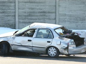 Calgary Police investigate and hold the scene on eastbound Memorial Drive NE near 28 Street in Calgary following an early-morning crash on Sunday, March 11, 2018.