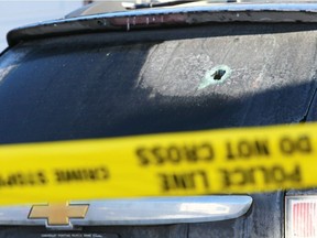 Calgary police hold the scene after reports of shots fired on Beddington Circle NE in Calgary late Saturday March 24, 2018.