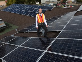 Clifton Lofthaug, Owner of Great Canadian Solar Ltd., with the new solar panels on the roof of the Devon Community Centre in Devon on Wednesday Sept. 9, 2015. John Lucas/Edmonton Journal