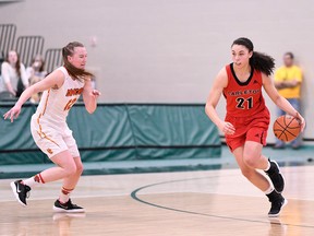 Elizabeth Leblanc of the Carleton Ravens (21) dribbles the basketball up the court against the Calgary Dinos during a U Sports Women's National Basketball Championship first-round game on March 8, 2018, at the Centre for Kinesiology, Health and Sport Regina. (Arthur Ward/Arthur Images)