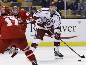 In this Feb. 5, 2018, file photo, Harvard forward Ryan Donato (16) looks to pass against Boston University during the Beanpot tournament in Boston. (AP Photo/Charles Krupa, File)