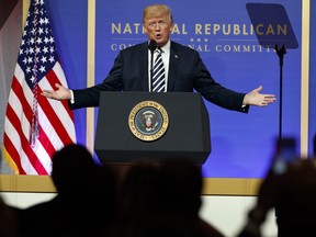 In this March 20, 2018, photo, U.S. President Donald Trump speaks to the National Republican Congressional Committee March Dinner at the National Building Museum in Washington.