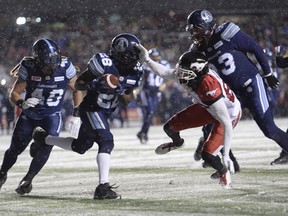 Toronto Argonauts defensive back Cassius Vaughn recovers the football on a fumble by Calgary Stampeders slotback Kamar Jorden during second half CFL football action in the 105th Grey Cup on Sunday, Nov. 26, 2017 in Ottawa. THE CANADIAN PRESS/Paul Chiasson