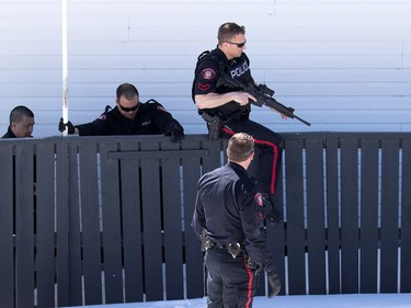 Police contain the scene where a police officer was shot in Abbeydale in Calgary on Tuesday March 27, 2018.