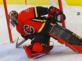 Mike Smith can't stop enough pucks in his return Sunday night to the Calgary Flames.