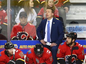 Flames Coach Glen Gulutzan watches the clock at the end of the game during NHL action between the Anaheim Ducks and the Calgary Flames on Wednesday, March 21, 2018 in Calgary at the Saddledome. (Jim Wells/Postmedia File Photo)