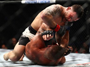 Frankie Edgar (top) fights rains down punches on Jeremy Stephens in their featherweight bout during UFC 205 at Madison Square Garden on November 12, 2016 in New York City. (Al Bello/Zuffa LLC/Zuffa LLC via Getty Images)