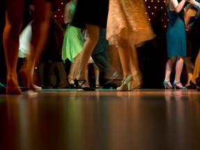 In this stock photo, students dance at a high school prom.
