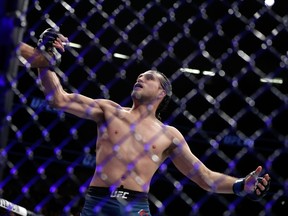 LAS VEGAS, NV - MARCH 03:  Brian Ortega celebrates his victory over Frankie Edgar following their featherweight bout during UFC 222 at T-Mobile Arena on March 3, 2018 in Las Vegas, Nevada. Ortega won by TKO.