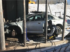 Cochrane RCMP photographed on scene at a property in Morley while executing a warrant.