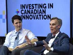 Prime Minister Justin Trudeau looks on as he participates in an armchair discussion with Bill Nye, right, highlighting Budget 2018's investments in Canadian innovation at the University of Ottawa in Ottawa on Tuesday, March 6, 2018. Nye asked Trudeau to explain the Kinder Morgan decision in front of university students, telling reporters later that he was surprised no one in the audience asked about pipelines.