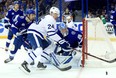 Maple Leafs froward Kasperi Kapanen tries to control the puck against the Tampa Bay Lightning on Tuesday night at Amalie Arena. (Getty Images)