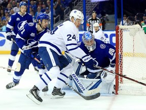 Maple Leafs froward Kasperi Kapanen tries to control the puck against the Tampa Bay Lightning on Tuesday night at Amalie Arena. (Getty Images)