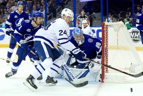 Maple Leafs froward Kasperi Kapanen tries to control the puck against the Tampa Bay Lightning on Tuesday night at Amalie Arena. (Getty Images)