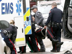 Calgary police at the scene in Abbeydale on Tuesday March 27, 2018 where a police officer was shot. The officer is reportedly in stable condition.