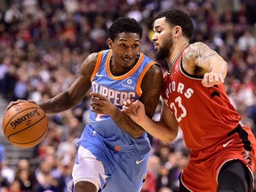 Los Angeles Clippers guard Lou Williams drives on Toronto Raptors guard Fred VanVleet during second half NBA basketball action in Toronto on Sunday, March 25, 2018. THE CANADIAN PRESS/Frank Gunn