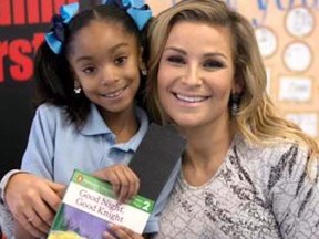 Nattie meets a new friend at a previous WrestleMania reading challenge event.