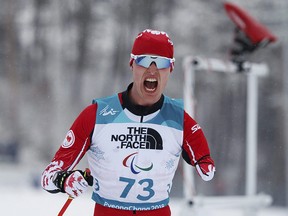 Mark Arendz of Hartsville, P.E.I., celebrates his victory in the Biathlon Standing Men's 15km at the 2018 Paralympic Winter Games at the Alpensia Biathlon Centre in Pyeongchang on Friday, March 16, 2018.