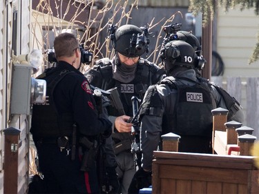Police contain the scene where a police officer was shot in Abbeydale in Calgary on Tuesday March 27, 2018.
